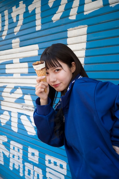 Side view woman holding ice cream cone