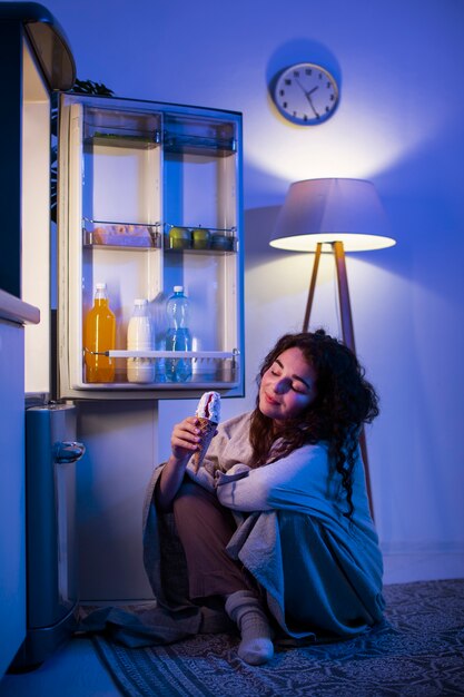 Side view woman holding ice cream