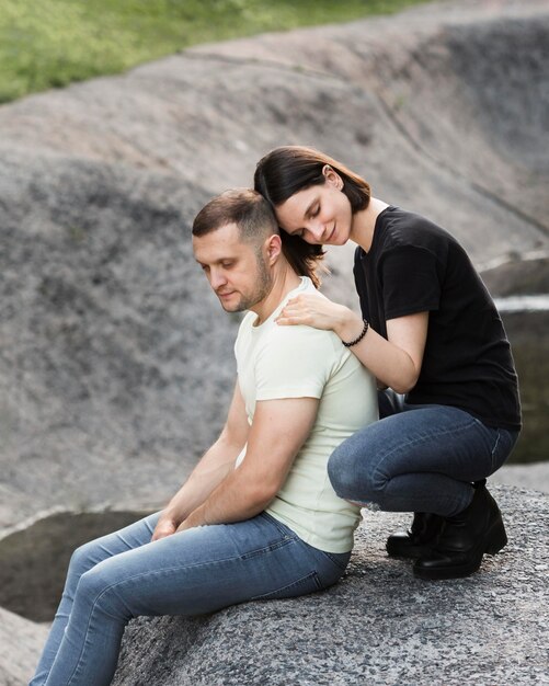 Side view woman holding man