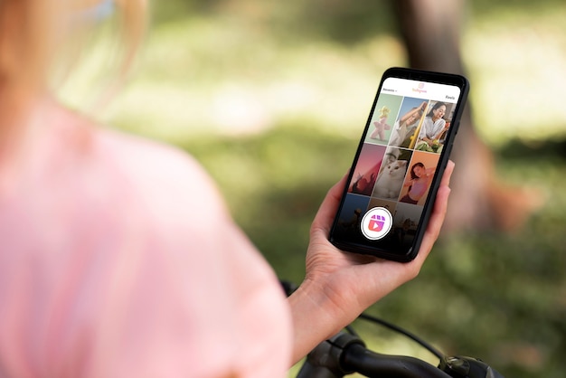 Side view woman holding smartphone