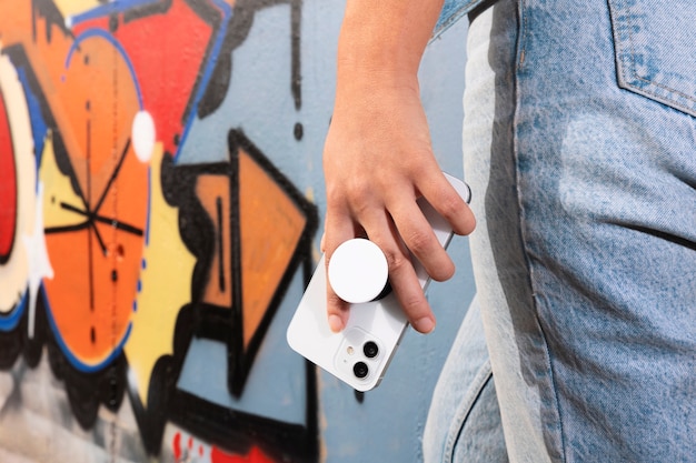side view woman holding smartphone