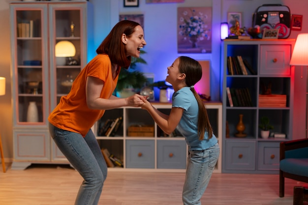 Side view woman and kid relaxing at home