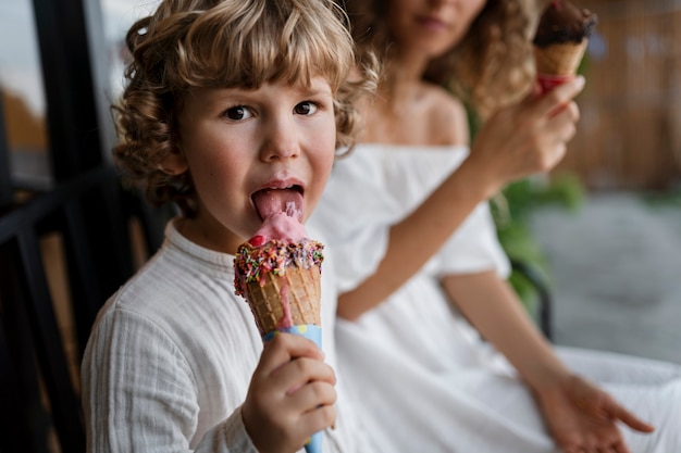 Side view woman and kid with ice creams