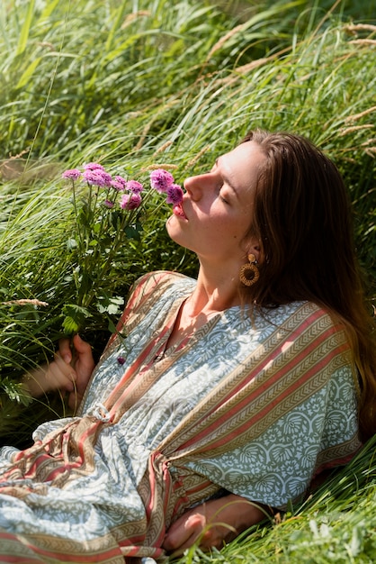 Side view woman laying on grass