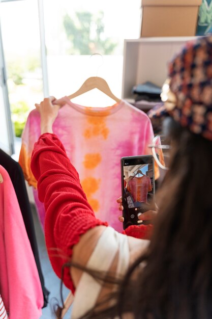 Side view woman looking at clothes