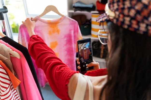 Side view woman looking at clothes