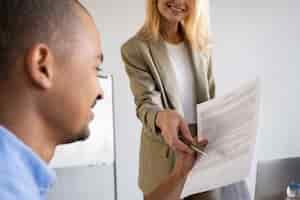 Free photo side view woman looking at document