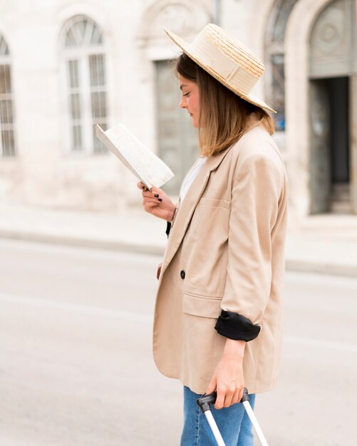 Side view woman looking at map