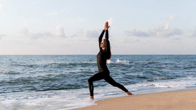 Side view woman meditating with copy space