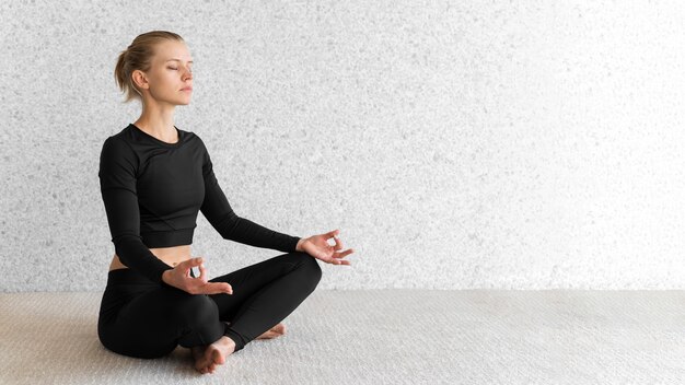 Side view woman meditating