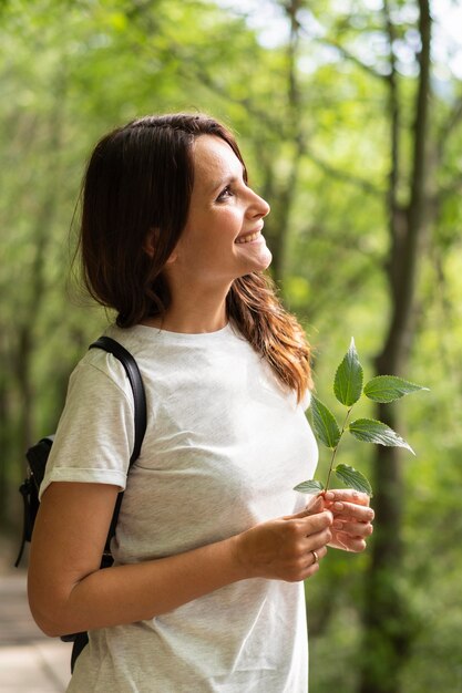 Side view of woman posing in nature