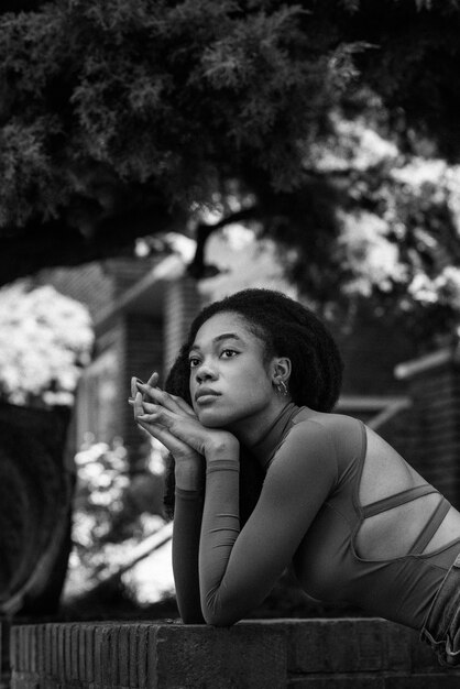 Side view woman posing outdoors