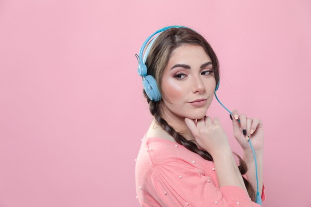 Side view of woman posing while listening to music with copy space