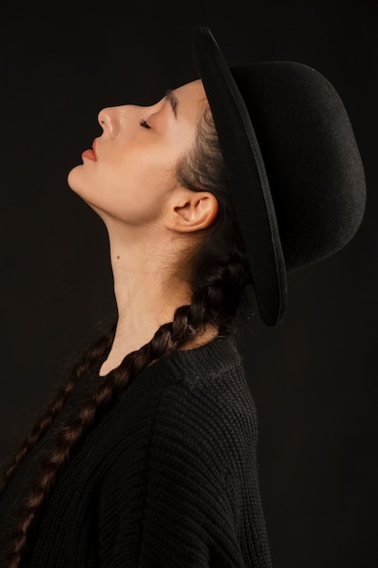 Side view woman posing with black outfit