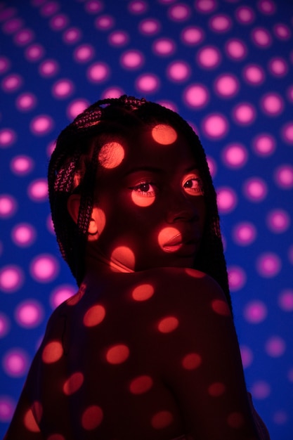 Side view woman posing with dots