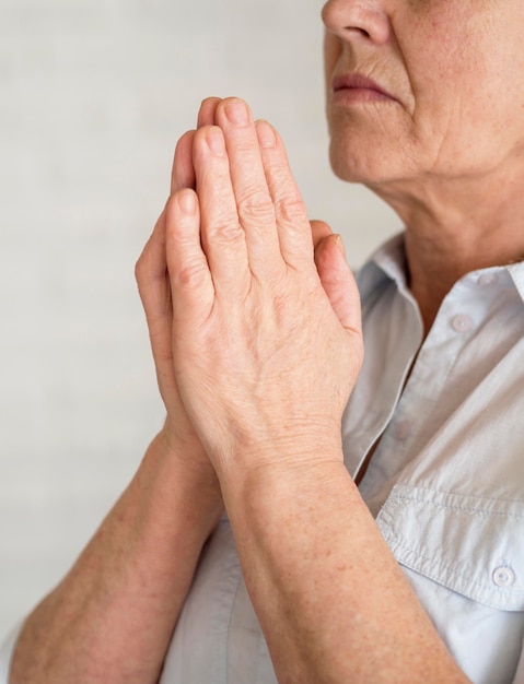 Side view of woman praying