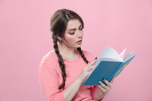 Side view of woman reading a book