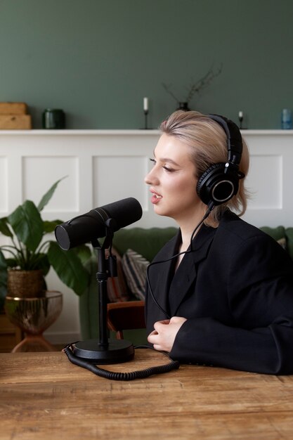 Side view woman recording podcast