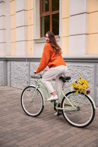 Side view of woman riding bicycle outdoors