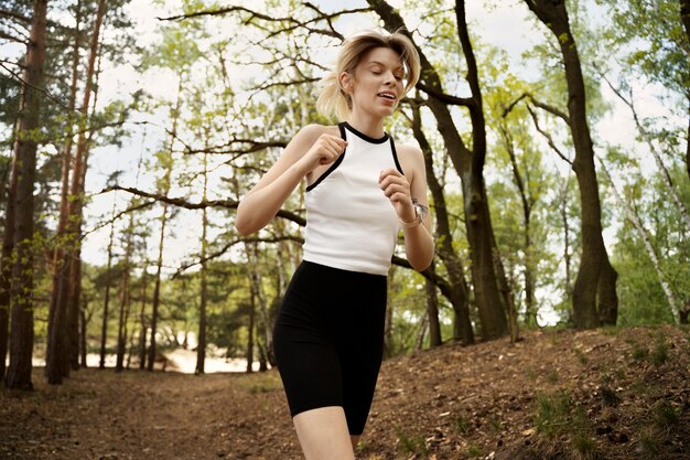 Side view woman running in nature