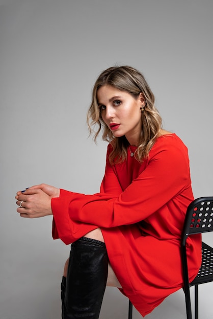 Side view woman sitting on chair