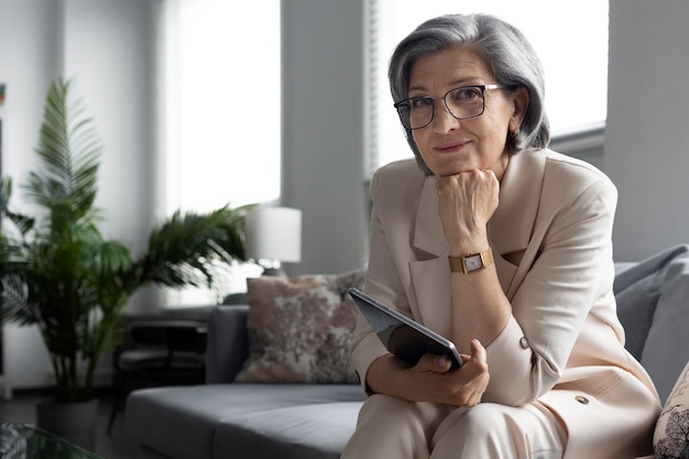 Side view woman sitting on couch