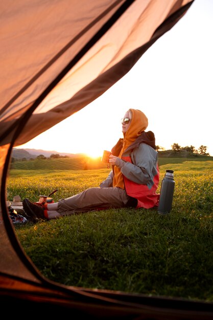 Side view woman sitting outdoors