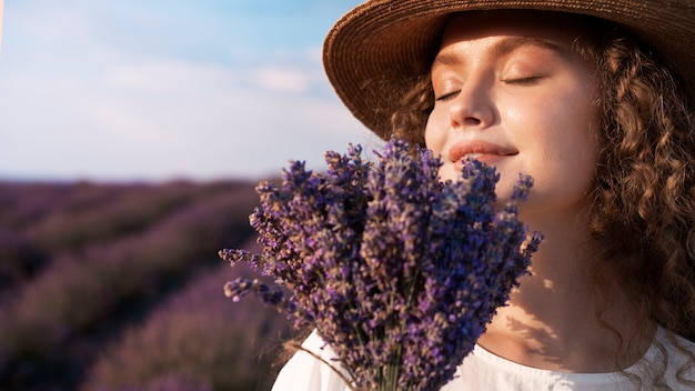 Side view woman smelling lavender