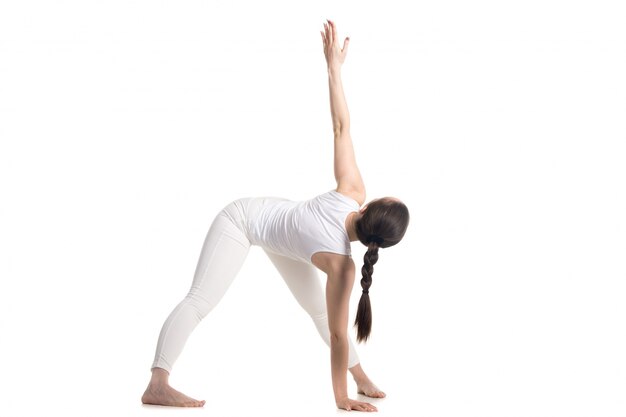 Side view of woman stretching her left arm