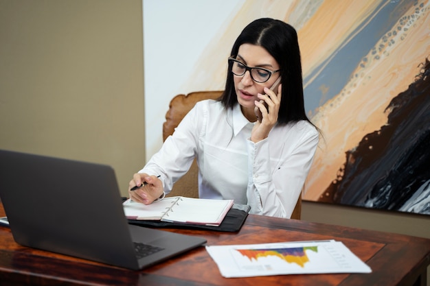 side view woman talking on phone