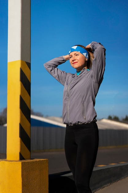 Side view woman training outdoors