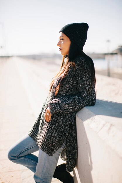 Side view of woman in urban environment