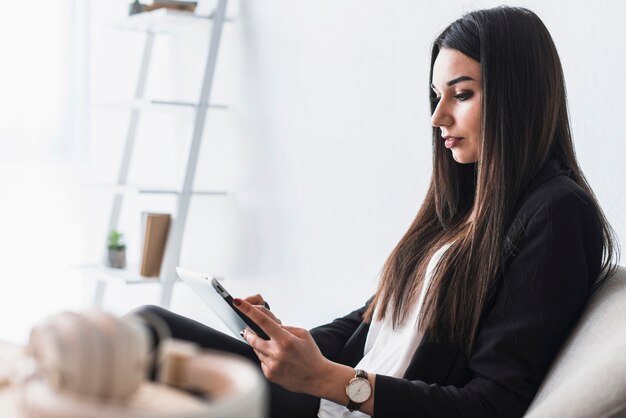 Side view woman using tablet