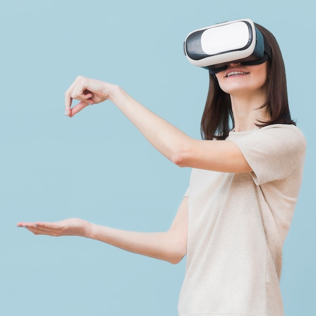 Side view of woman using virtual reality headset