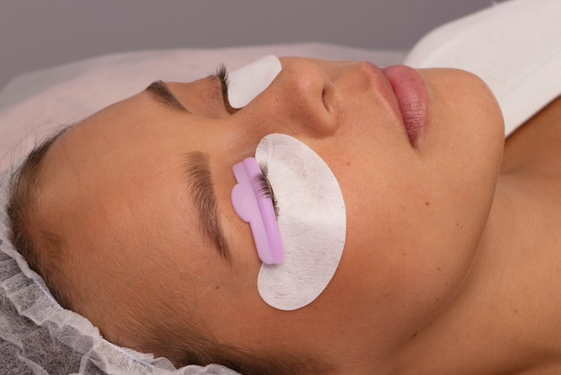 Side view woman wearing eye patches