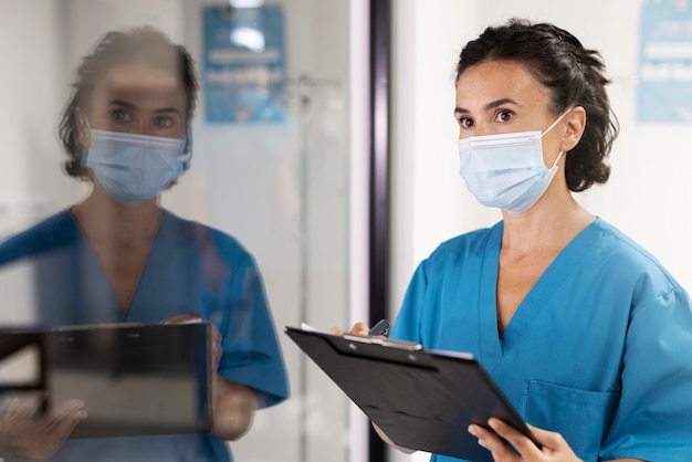 Free Photo side view woman wearing face mask