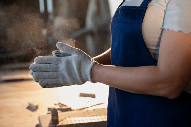 Side view woman wearing protection gloves