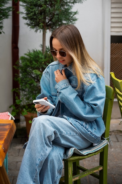 Side view woman wearing total denim outfit