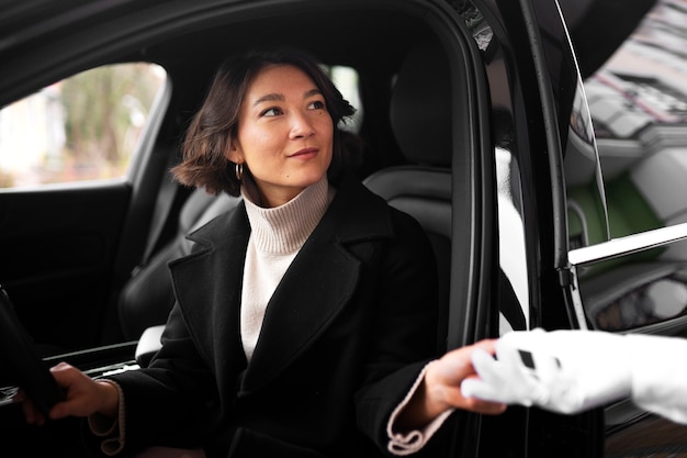 Side view woman with car