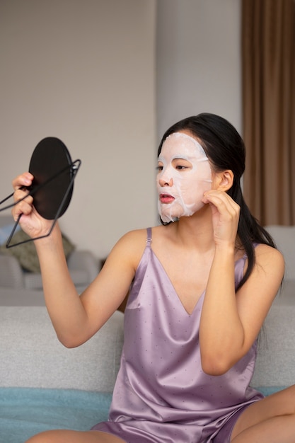 Free photo side view woman with face mask