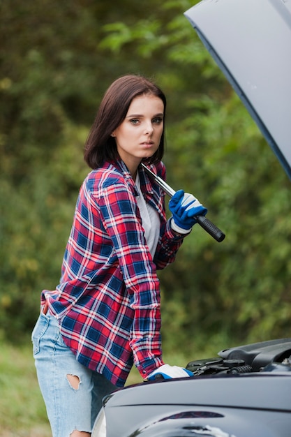 Side view of woman with flannel shirt