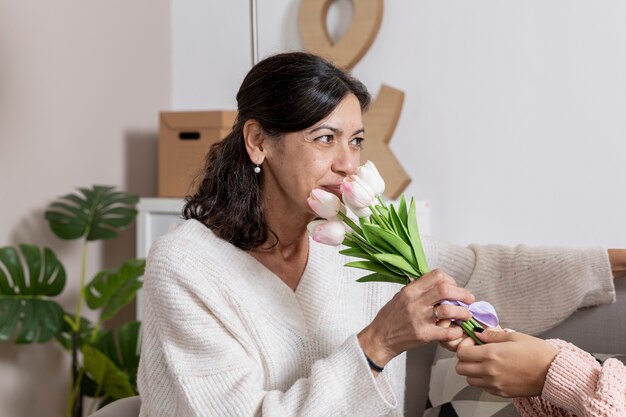 Side view woman with flowers