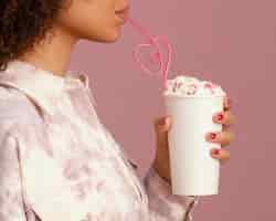 Free photo side view of woman with frappe