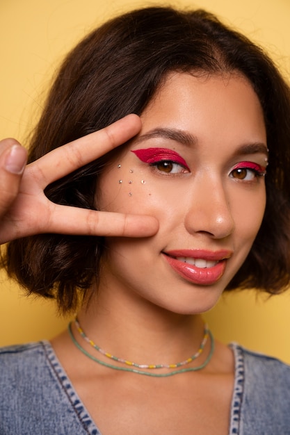 Side view woman with graphic eye makeup