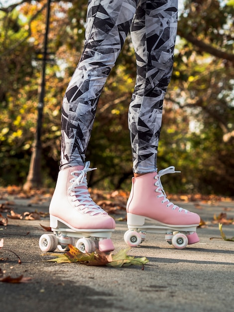Side view of woman with roller skates and leggings