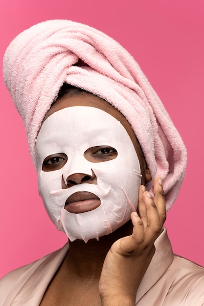 side view woman with sheet mask