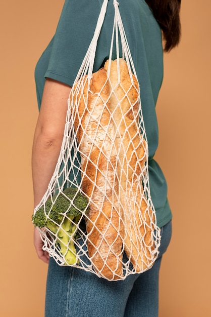 Free photo side view woman with turtle bag close up