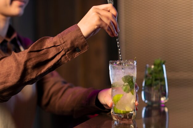 Free photo side view woman working as bartender