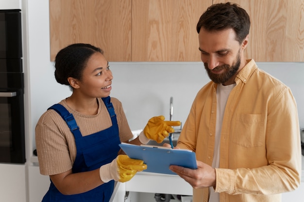 Free photo side view woman working as plumber