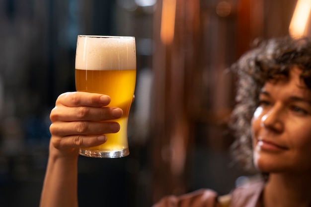 Side view woman working in beer factory